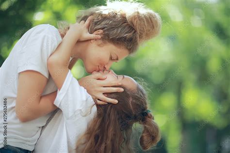 daughter kiss mother